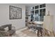Bright office space featuring a large window, desk, and stylish decor at 5013 Coronado, Raleigh, NC 27609