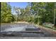 In-ground pool under construction with separate spa and tanning ledge surrounded by a wooded area at 5013 Coronado, Raleigh, NC 27609