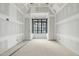 Unfinished room with custom ceiling detail and black grid window, waiting to be customized at 5013 Coronado, Raleigh, NC 27609