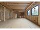 Unfinished room with wood framework, open floor plan, and new subfloor, ready for your personalization at 5013 Coronado, Raleigh, NC 27609