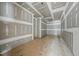 View of unfinished room with drywall and wood subfloor at 5013 Coronado, Raleigh, NC 27609