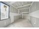 Unfinished room showcases a vaulted ceiling with recessed lighting and a large window at 5013 Coronado, Raleigh, NC 27609