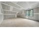 Spacious room with high ceilings and a window allowing natural light during construction at 5013 Coronado, Raleigh, NC 27609