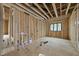 Unfinished room with wood framework, a window, and a newly installed subfloor ready for your design at 5013 Coronado, Raleigh, NC 27609