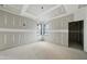 Under-construction room with tray ceilings and lots of natural light from dual windows at 5013 Coronado, Raleigh, NC 27609