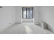 Bright room featuring a large window and a white door at 5013 Coronado, Raleigh, NC 27609