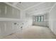 Unfinished room featuring a window and drywall, ready for customization at 5013 Coronado, Raleigh, NC 27609