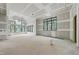 Large unfinished room with expansive windows, waiting for your personal touch at 5013 Coronado, Raleigh, NC 27609