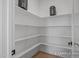 Walk-in pantry featuring ample shelving for organized storage at 5060 Trotter Dr, Raleigh, NC 27603