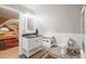 Bathroom featuring stylish vanity and sink with lighting, next to toilet and custom shelving at 5405 Bluet Ct, Holly Springs, NC 27540