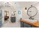 Bright bathroom with double sinks, Shiplap walls, and modern fixtures and access to the bedroom at 5405 Bluet Ct, Holly Springs, NC 27540