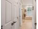 Luxurious bathroom with soaking tub, tiled floors, and natural light from a window at 5405 Bluet Ct, Holly Springs, NC 27540