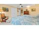 A comfortable bedroom features two twin beds, ceiling fan, and ensuite bathroom at 5405 Bluet Ct, Holly Springs, NC 27540