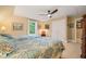 A comfortable bedroom features two twin beds, ceiling fan, ensuite bathroom, and double door closet at 5405 Bluet Ct, Holly Springs, NC 27540