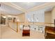 Bright hallway with a decorative chair and a railing overlooking the floor below at 5405 Bluet Ct, Holly Springs, NC 27540