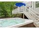 Inviting backyard hot tub with clear water and a nearby deck, perfect for outdoor relaxation at 5405 Bluet Ct, Holly Springs, NC 27540