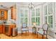 Cozy breakfast nook with natural light, shutters, and an adjacent, functional kitchen area at 5405 Bluet Ct, Holly Springs, NC 27540