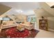 Upstairs room with sitting area, bookshelves, and game table with lots of light at 5405 Bluet Ct, Holly Springs, NC 27540