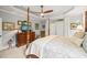 Spacious bedroom featuring a tray ceiling, a four-poster bed, and a wooden dresser at 5405 Bluet Ct, Holly Springs, NC 27540