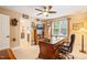 Home office with built-in shelves, a classic desk, and natural light at 5405 Bluet Ct, Holly Springs, NC 27540