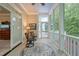 Inviting screened-in porch with seating, an outdoor rug, and a view of the serene surroundings at 5405 Bluet Ct, Holly Springs, NC 27540
