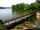Picturesque view of the lake with a bridge spanning the water at 5405 Bluet Ct, Holly Springs, NC 27540