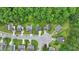 A high angle aerial shot of a residential neighborhood with tree-lined streets at 5408 Gunnette Dr, Raleigh, NC 27610