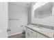 Bathroom featuring granite vanity and mirror at 5408 Gunnette Dr, Raleigh, NC 27610