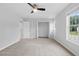 Bedroom with neutral walls, carpet, closet, and a ceiling fan at 5408 Gunnette Dr, Raleigh, NC 27610