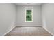 Neutral bedroom featuring a window offering natural light at 5408 Gunnette Dr, Raleigh, NC 27610