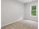 Empty bedroom featuring a window offering natural light at 5408 Gunnette Dr, Raleigh, NC 27610