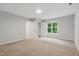 Spacious bedroom with neutral carpet, a window letting in natural light, and closet space at 5408 Gunnette Dr, Raleigh, NC 27610