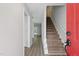 Inviting entryway with stairs, light gray walls, wood-look flooring and a bright white trim at 5408 Gunnette Dr, Raleigh, NC 27610