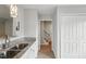 Modern kitchen featuring stainless steel appliances, granite countertops, and white cabinets at 5408 Gunnette Dr, Raleigh, NC 27610