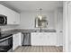 Modern kitchen featuring stainless steel appliances, granite countertops, and white cabinets at 5408 Gunnette Dr, Raleigh, NC 27610