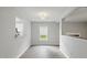 Bright living room featuring wood-look flooring, neutral paint and an open layout at 5408 Gunnette Dr, Raleigh, NC 27610