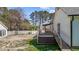A large wooden deck with ramps adds an accessible outdoor living space to this charming home at 5437 Grasshopper Rd, Raleigh, NC 27610