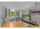 Spacious exercise room with hardwood floors, multiple windows, and fitness equipment at 5805 Laurel Rock Ln, Raleigh, NC 27613