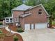 Beautiful brick home featuring an attached two car garage and professionally landscaped yard at 5805 Laurel Rock Ln, Raleigh, NC 27613