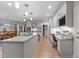 Expansive kitchen with granite counters, white cabinets, stainless appliances, and an office nook at 5805 Laurel Rock Ln, Raleigh, NC 27613