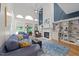 Living room with high ceilings, a fireplace, custom built-ins, and comfortable seating at 5805 Laurel Rock Ln, Raleigh, NC 27613