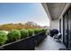 Outdoor balcony with decorative planters, modern patio furniture, and a charcoal grill at 620 Wade Ave # 505, Raleigh, NC 27605