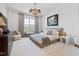 Cozy bedroom with a plush bed, decorative lighting, and a stylish accent chair at 620 Wade Ave # 505, Raleigh, NC 27605