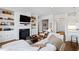 Cozy living room with fireplace, built-in bookshelves, and comfortable seating area at 620 Wade Ave # 505, Raleigh, NC 27605