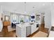 Open concept living space with a kitchen island, dining area, and living room at 620 Wade Ave # 505, Raleigh, NC 27605