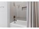 Clean bathtub and shower with gray tiled walls and a convenient built-in niche at 620 Wade Ave # 505, Raleigh, NC 27605