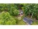 Aerial shot of a charming home nestled among lush greenery, showcasing its serene setting at 627 Gaslight Trl, Wendell, NC 27591