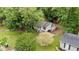 Aerial view of a home with lush, mature trees surrounding the property at 627 Gaslight Trl, Wendell, NC 27591