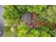 Aerial shot showcasing the roof of the home surrounded by lush trees at 627 Gaslight Trl, Wendell, NC 27591