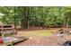 Expansive backyard featuring mature trees and lush greenery at 627 Gaslight Trl, Wendell, NC 27591